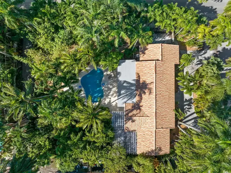 Aerial view of The Wellness Retreat surrounded by tropical trees