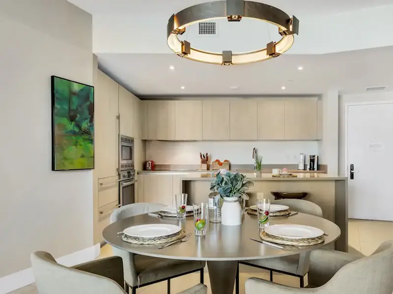 Dining table next to the fully equipped kitchen