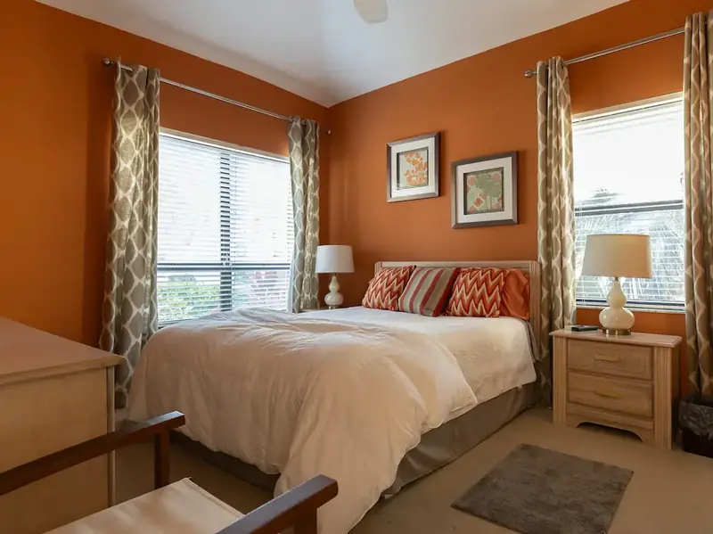 Bedroom with warm orange accent wall